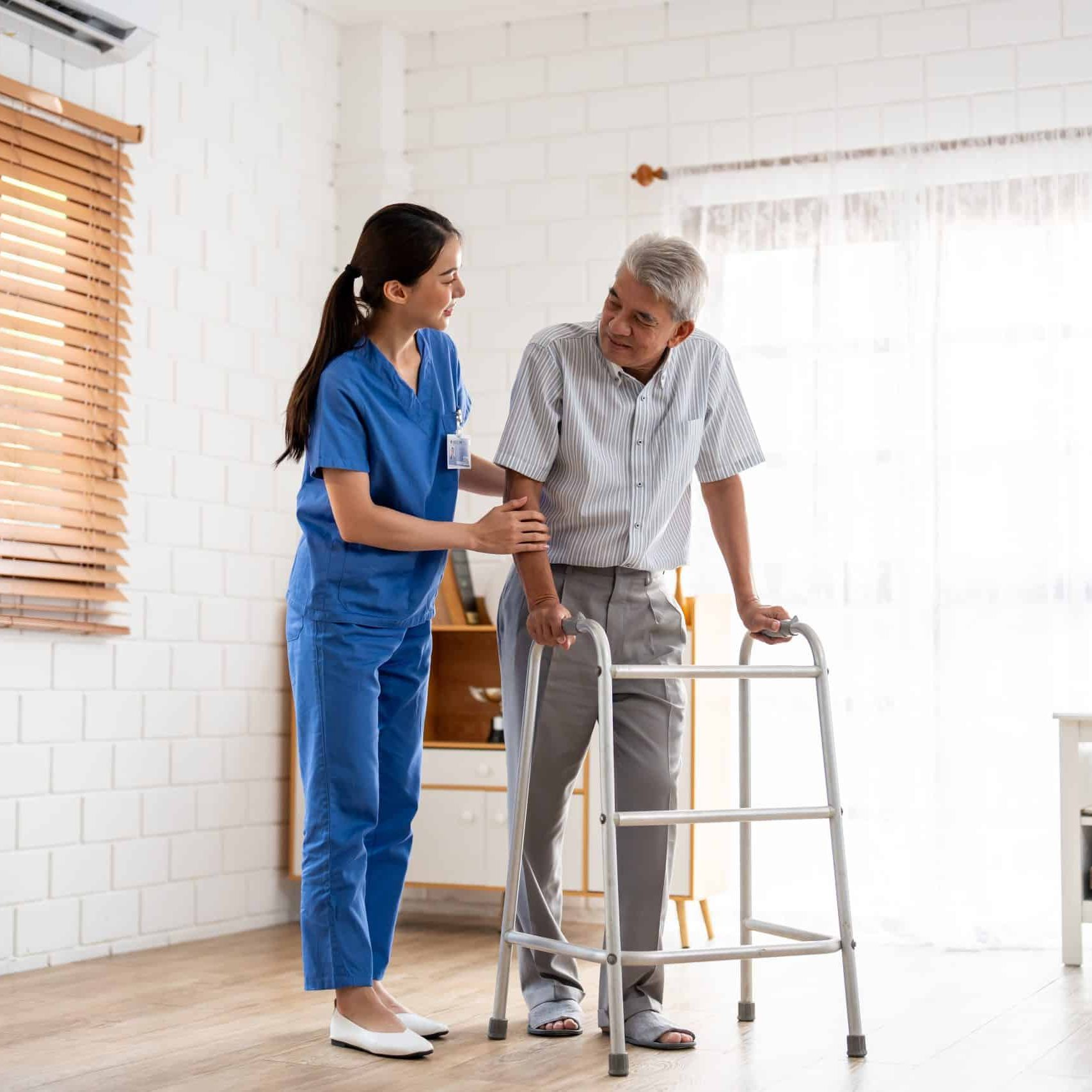 Asian senior elderly man patient doing physical therapy with caregiver